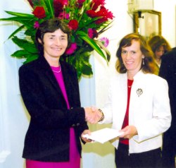 Janet being presented with her award by Estelle Morris